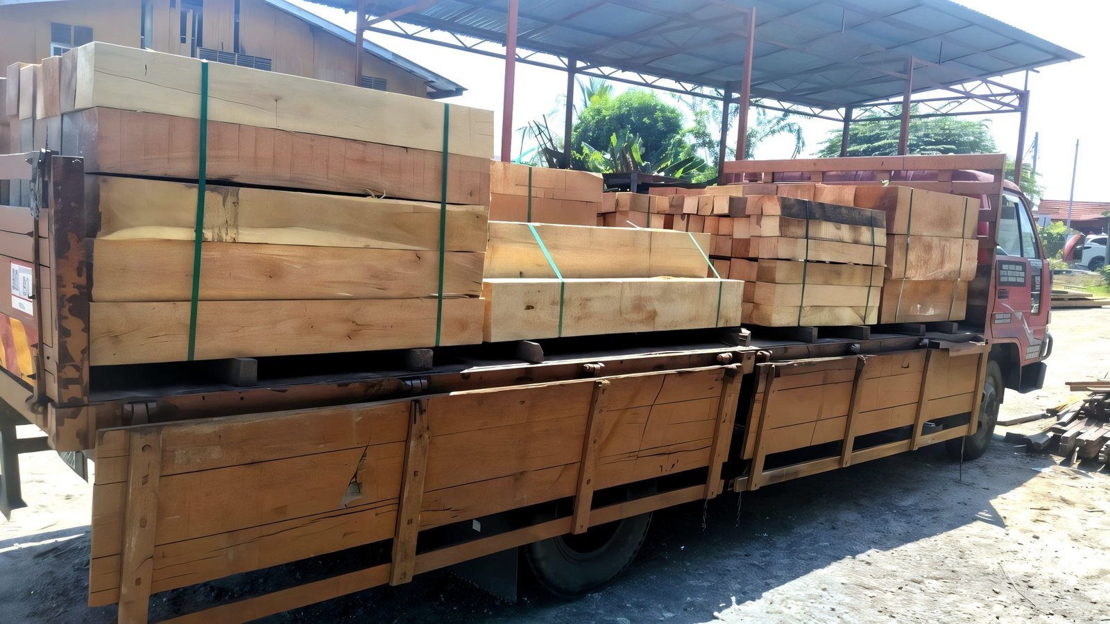 A Hang Soon Timber lorry loaded with sawn timber for site delivery